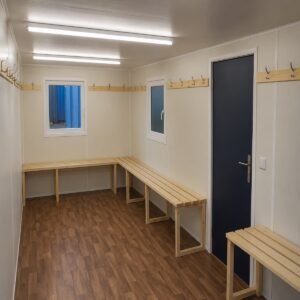 Fitted drying benches and high-level fan heater inside drying room cabin for sale in Australia.