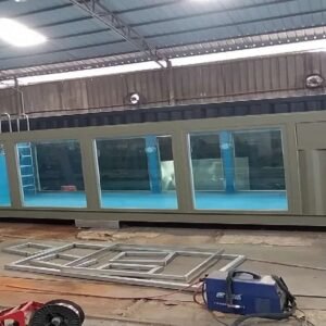 40ft container pool for sale - olive green exterior, full-length glass viewing panels, blue fibreglass interior, entry ladder, factory built, available in Australia
